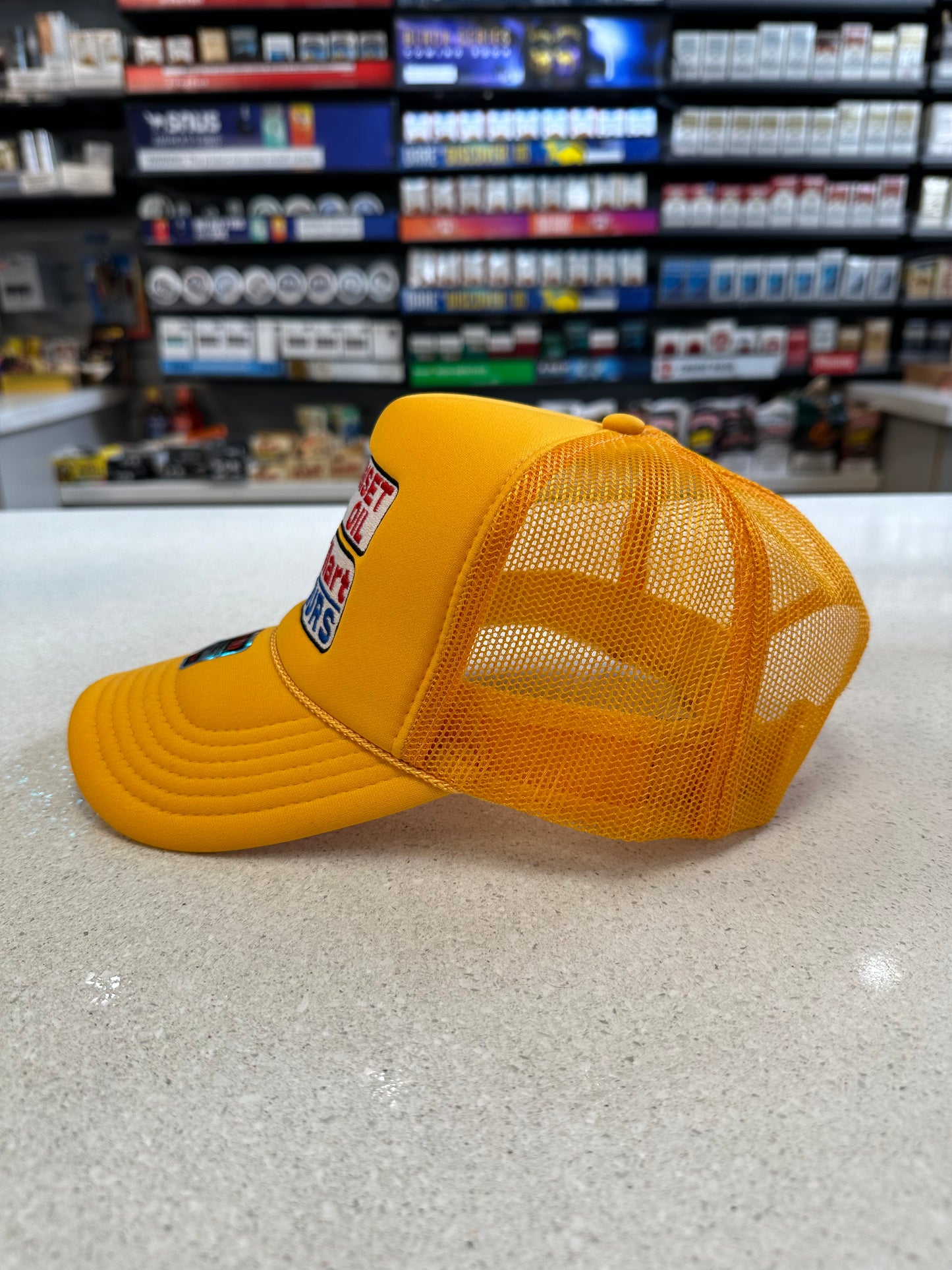 Sunset Oil Mini Mart Gold Trucker Hat