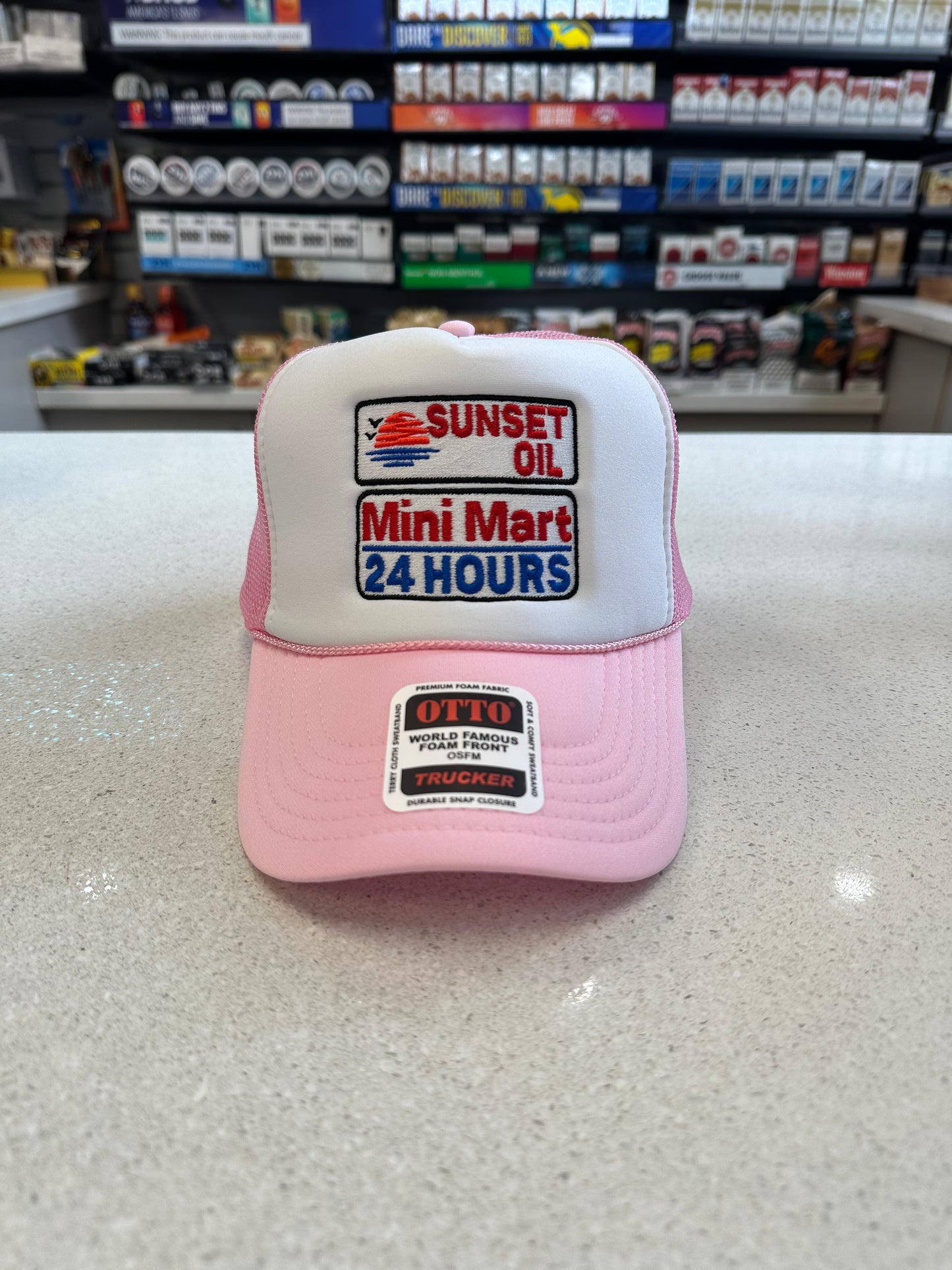 Sunset Oil Mini Mart Pink and White Trucker Hat