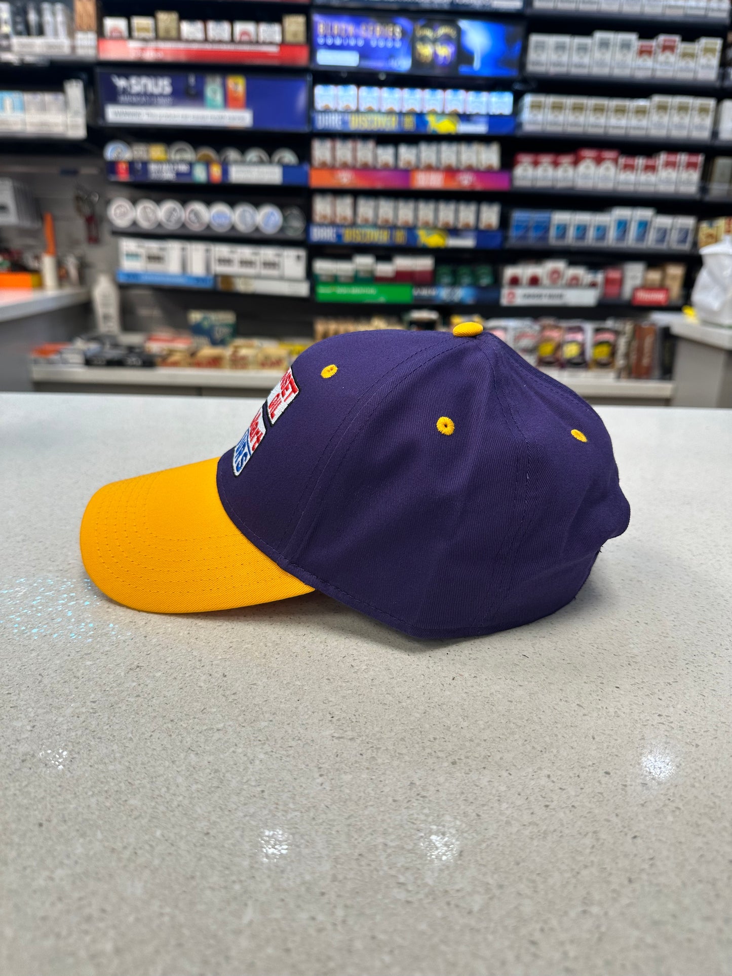 Sunset Oil Mini Mart Gold/Purple/Purple Low Profile Baseball Cap