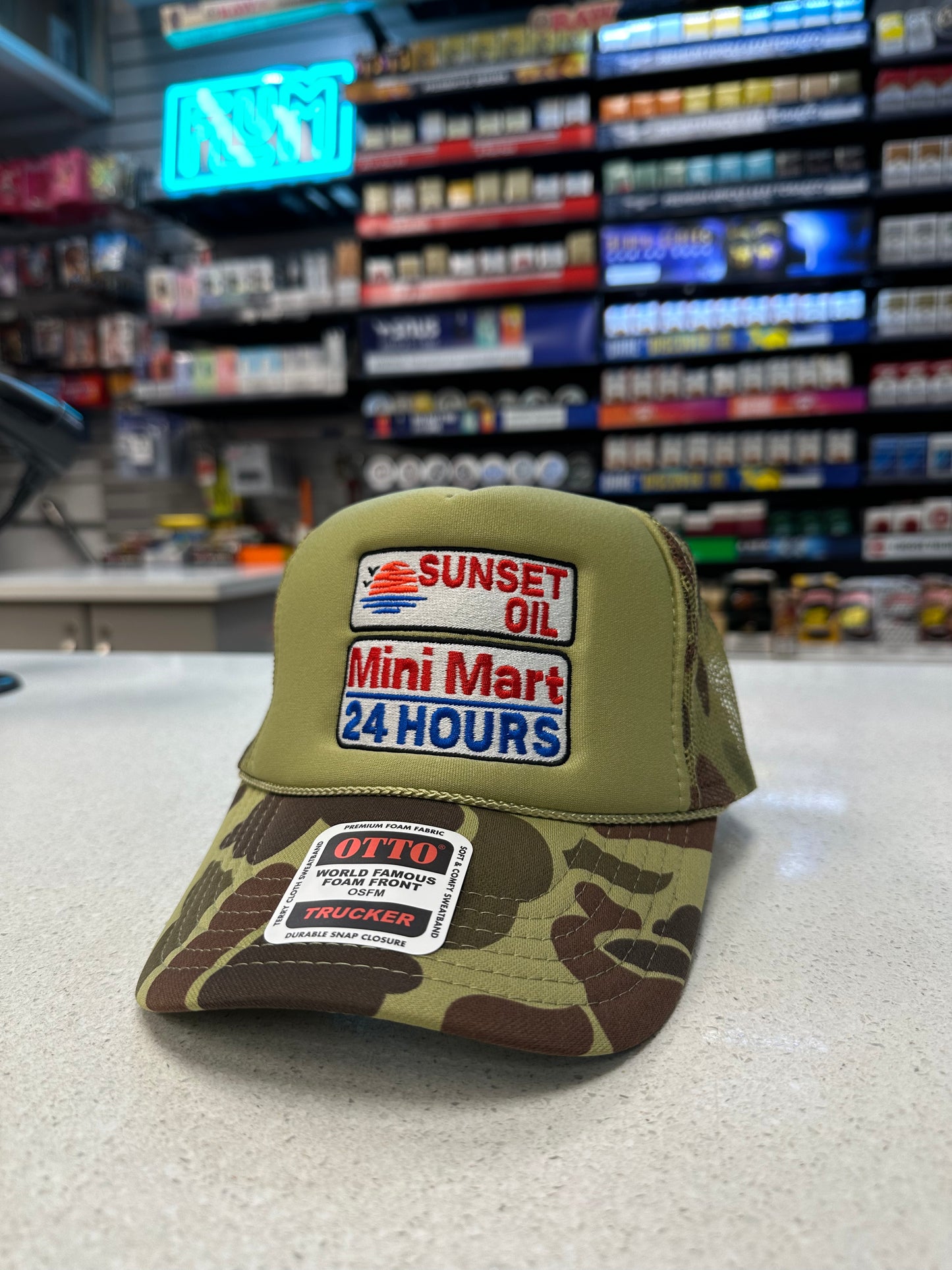 Sunset Oil Mini Mart Camouflage Trucker Hat