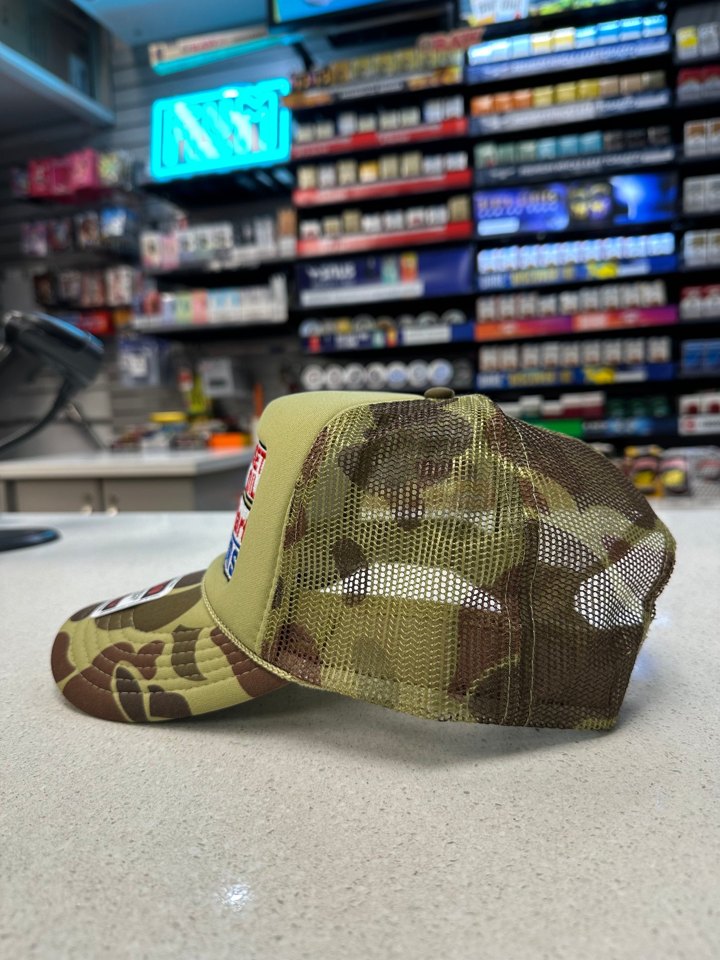 Sunset Oil Mini Mart Camouflage Trucker Hat